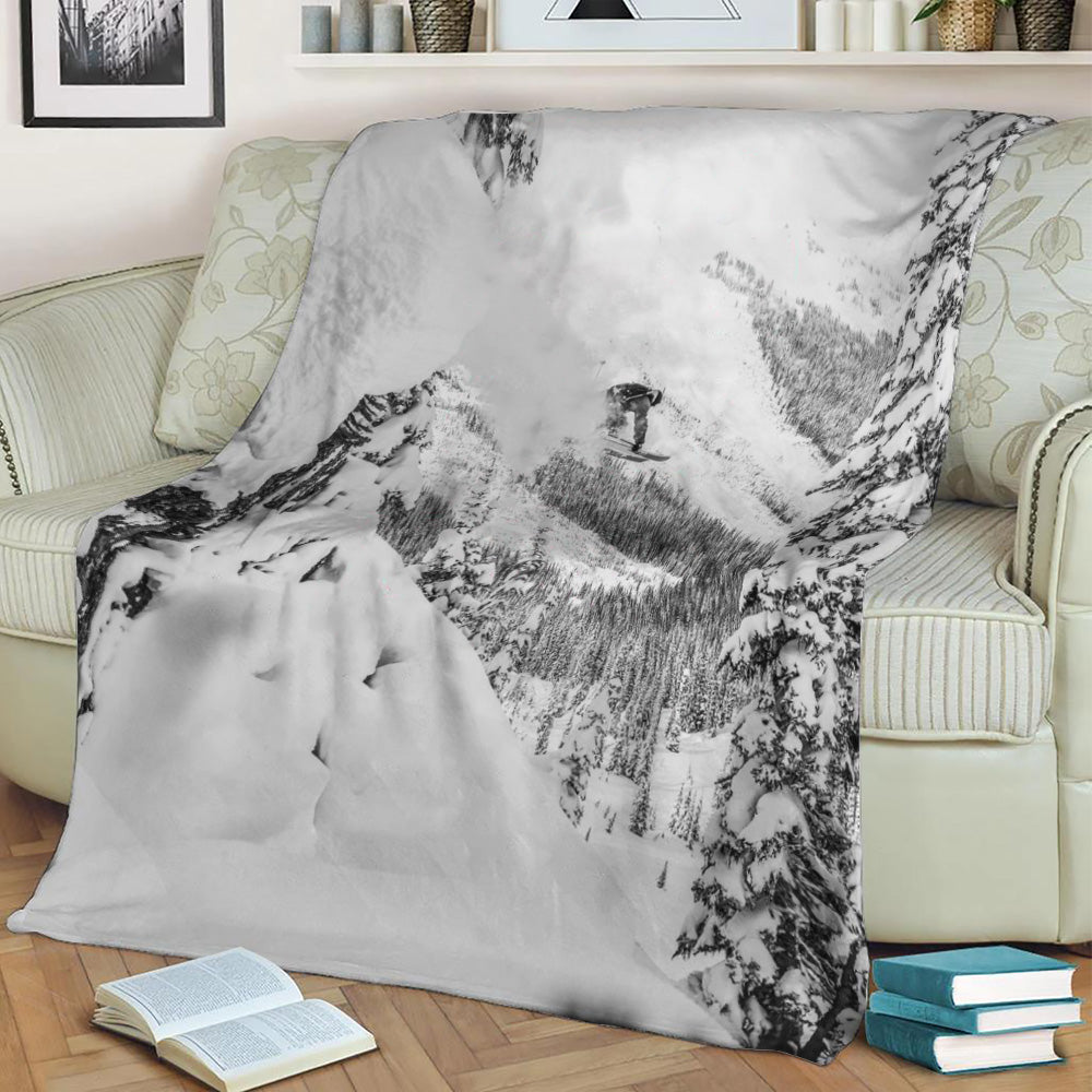 Skier going off cliff Fleece Throw Blanket