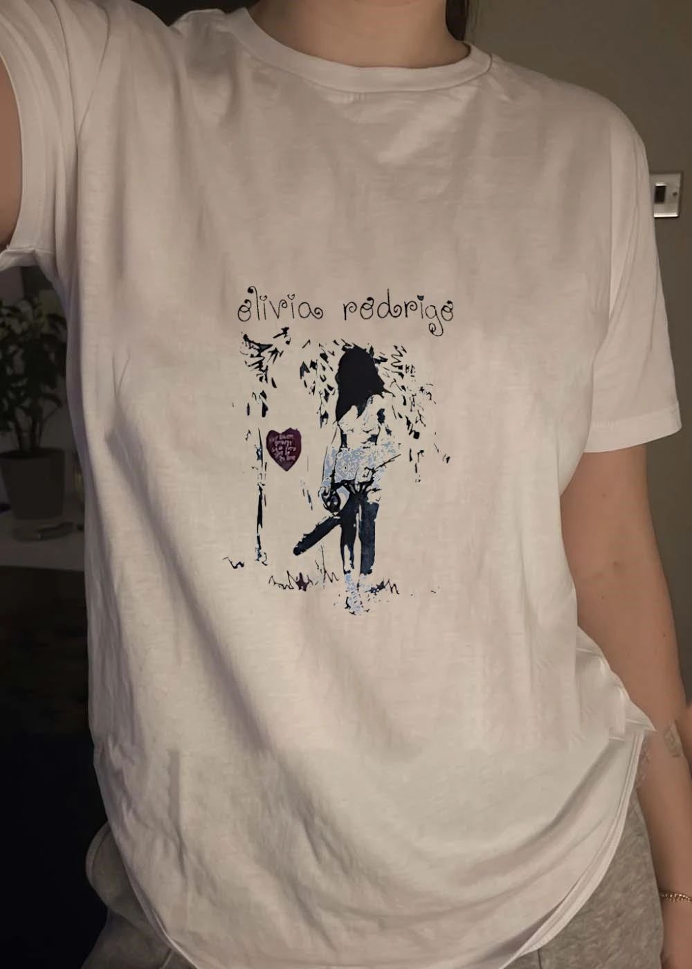 Olivia Rodrigo Girl with Chainsaw and Wolf Heart T-Shirt