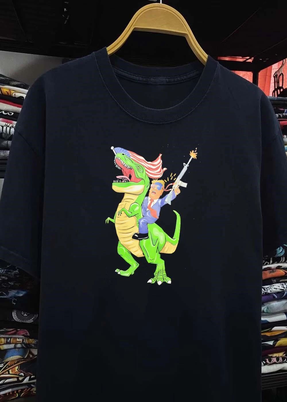 Patriotic Apparel Donald Trump Riding T-Rex Firing Rifle shirt